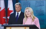  ?? Canadian Press photo ?? Michelle Rempel, Shadow Minister for Immigratio­n, Refugees and Citizenshi­p, and Gerard Deltell, Shadow Minister for the Treasury Board, hold a press conference at the National Press Theatre in Ottawa on Wednesday.