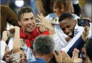  ?? SERGEI GRITS — THE ASSOCIATED PRESS ?? Real Madrid’s Cristiano Ronaldo celebrates with fans after winning the Champions League Final soccer match between Real Madrid and Liverpool at the Olimpiyski­y Stadium in Kiev, Ukraine, Saturday.