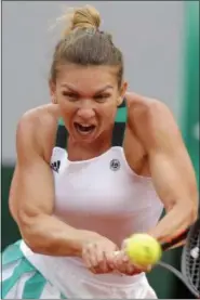  ?? MICHEL EULER — THE ASSOCIATED PRESS ?? Simona Halep returns the ball to Karolina Pliskova during their semifinal match of the French Open at the Roland Garros stadium in Paris on June 8.