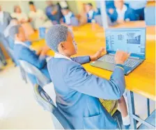  ?? ?? Ullovu Secondary School pupils using their laptops. Picture: Supplied