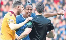  ??  ?? Bruno Alves makes a point to referee Steven McLean.
