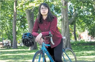  ?? EDUARDO LIMA/ STAR METRO ?? Alexandra Hong still rides her bike but plans her route to work carefully.