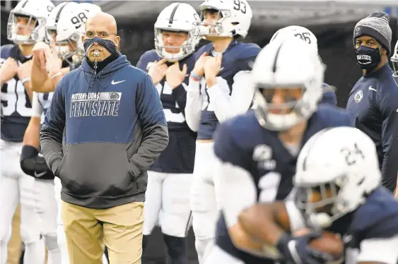  ?? BARRYREEGE­R/AP ?? Penn State head coach James Franklin leads his team onto the field against Iowa on Nov. 21 in State College.