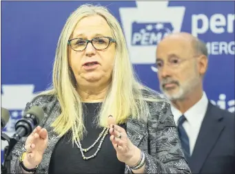  ?? ASSOCIATED PRESS ?? Pennsylvan­ia Secretary of Health Dr. Rachel Levine provides an update on the coronaviru­s and outline steps Pennsylvan­ians can take to keep themselves healthy last March as Gov. Tom Wolf listens in background.