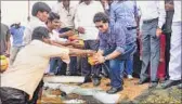  ??  ?? Tendulkar performs rituals as he adopts the village on Sunday