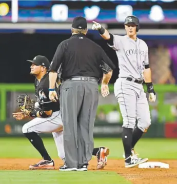  ?? Mark Brown, Getty Images ?? DJ LeMahieu asks for a video replay after he was called out at second base in the third inning of Friday night’s game at Miami. He left the game with a tweaked hamstring.