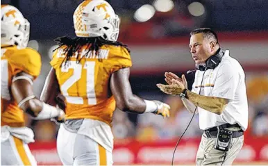  ??  ?? Tennessee coach Butch Jones applauds his defensive players during the first half of Saturday’s game against Virginia Tech at Bristol Motor Speedway in Bristol, Tenn. Jones said the Vols must get off to better starts the rest of the season.