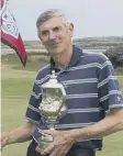  ??  ?? Bob Humble with the trophy