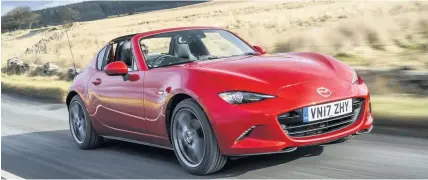  ??  ?? The Mazda MX-5 RF is always a fun drive.