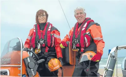  ??  ?? LIFESAVERS: Retired American naval pilot Ashley Rose and her husband Jerry are both on the lifeboat crew