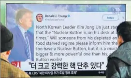  ?? AP ?? People watch a television news programme showing the Twitter post of US President Donald Trump while reporting North Korea's nuclear issue, at Seoul Railway Station in South Korea. The Korean letters on the screen read: “More powerful nuclear button.”