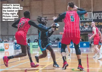  ?? ?? Hobart’s Jamar Sandifer drives to the basket on Friday night. Picture: Linda Higginson