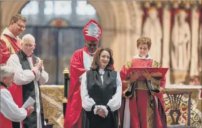  ??  ?? ‘HUGE HONOUR’: The Reverend Dr Jill Duff’s consecrati­on as the Suffragan Bishop of Lancaster, at York Minster, with Dr John Sentamu presiding.