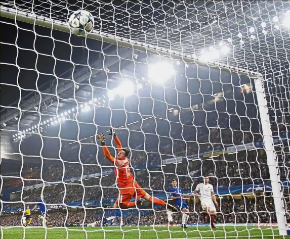 ?? — AP ?? Tough times: AS Roma’s Edin Dzeko (right) scoring against Chelsea in the Champions League at Stamford Bridge on Wednesday. The match ended 3-3.
