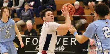  ?? Photo by Kris Everett ?? Junior forward Dylan Velez looks for the open pass in Wednesday’s game against Maconaquah.