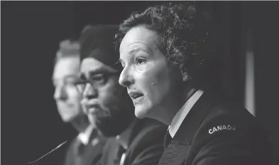  ?? DAVID KAWAI / THE CANADIAN PRESS ?? The military’s top legal officer, Judge Advocate-general Commodore Genevieve Bernatchez, right, speaks on military justice reforms during a press conference Thursday with Defence Minister Harjit Sajjan.