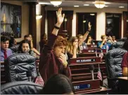  ?? AUDRA MELTON / THE NEW YORK TIMES ?? Ryan Deitsch, 18, and other students from Marjory Stoneman Douglas High School met with lawmakers on the House floor at the Florida State Capitol on Wednesday in Tallahasse­e. They advocated for a range of new gun control measures.