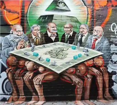  ?? ?? Storm: The mural depicts bankers playing Monopoly on the backs of slave-like figures