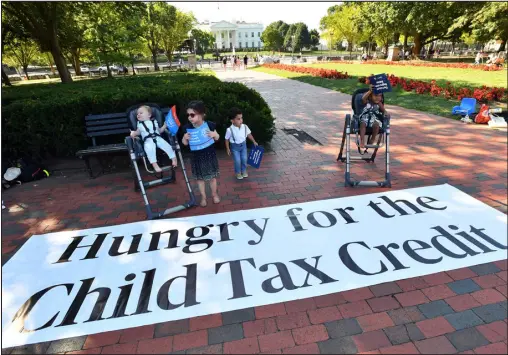  ?? LARRY FRENCH— GETTY IMAGES FOR SKDK/ TNS ?? Parents and caregivers with the Economic Security Project gather outside the White House to advocate for the Child Tax Credit in advance of the White House Conference on Hunger, Nutrition, and Health on Sept. 20 in Washington, D. C.