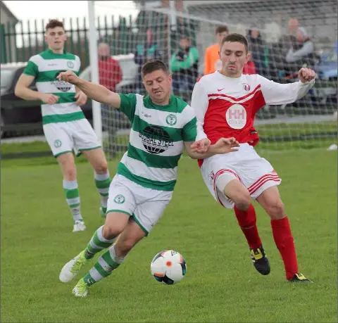  ??  ?? Eamon O’Brien of Shamrock Rovers and Pa O’Shea of Moyne Rangers in a battle for possession during their Premier Division game.