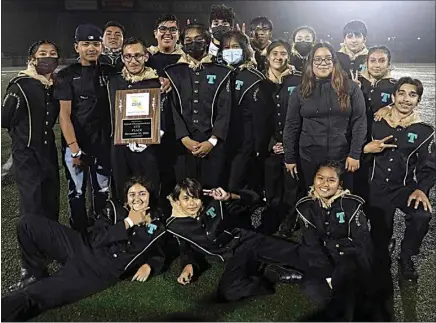  ?? BY ARNOLD MORRISON ?? The Robert F. Kennedy High School Band poses with their plaque after placing fourth in the state championsh­ip at Newport Harbor High School on Nov. 20.