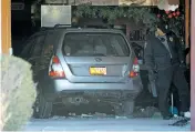  ?? LUIS SÁNCHEZ SATURNO/THE NEW MEXICAN ?? A vehicle sits inside Jambo Café on Thursday after its driver plowed through the front of the restaurant on Cerrillos Road during the lunch hour. Four people were taken to the Christus St. Vincent Regional Medical Center.