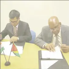  ??  ?? Signing on behalf of Guyana was Minister of Finance Winston Jordan (right) while Sailesh Prasad, Resident Representa­tive signed on behalf of the Export-Import Bank of India.