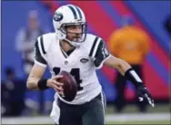  ?? BILL KOSTROUN — THE ASSOCIATED PRESS ?? After a protracted stalemate, a person familiar with the negotiatio­ns says the New York Jets have re-signed quarterbac­k Ryan Fitzpatric­k to a one-year deal worth $12 million.
