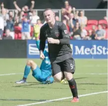  ?? — USA Today Sports ?? DC United forward Wayne Rooney (9) celebrates after scoring a goal against Chicago Fire at Audi Field. United won 2-1.