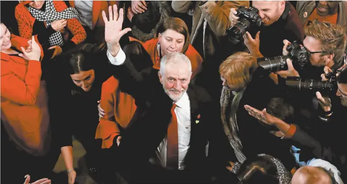  ??  ?? British Labour leader Jeremy Corbyn waves to his supporters after giving an election campaign speech last month.