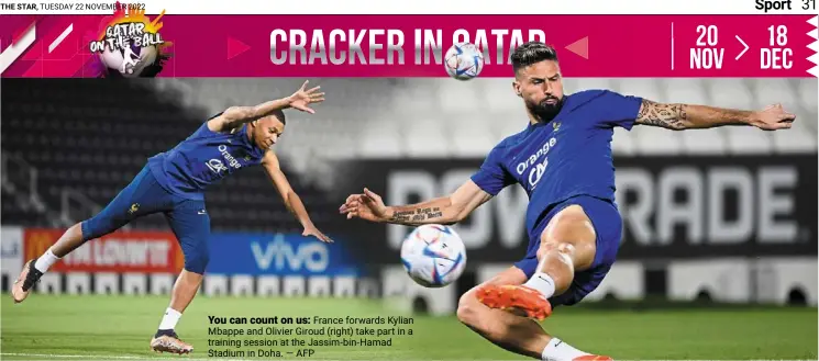  ?? — AFP ?? You can count on us: France forwards Kylian mbappe and olivier Giroud (right) take part in a training session at the Jassim-bin-hamad Stadium in doha.