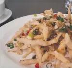  ??  ?? Spicy salt and pepper whitebait, left, with a combo omelet and gravy at Jingili’s Ming Court Chinese Restaurant