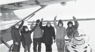  ?? YUKON KUSKOKWIM HEALTH CORP. ?? Alaska health care workers prepare to board a plane to deliver vaccines to remote areas.