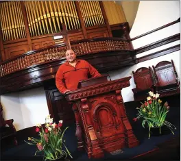  ??  ?? Pastor John A. Ricci stands at the lectern of the renovated Grace Christian Fellowship Church in Woonsocket Thursday.