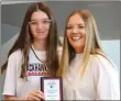  ?? ?? Annette Beard/Pea Ridge TIMES Assistant coach Elzie Yoder presented the Hustle Award to Madison Knight, voted on by her team mates.