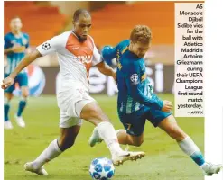  ??  ?? AS Monaco’s Djibril Sidibe vies for the ball with Atletico Madrid’s Antoine Griezmann during their UEFA Champions League first round match yesterday. –