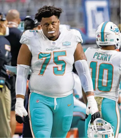  ?? JENNIFER STEWART/AP ?? Dolphins offensive guard Ereck Flowers reacts on the sidelines during a game against the Cardinals in Glendale, Ariz.