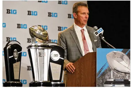  ?? DAVID JABLONSKI / STAFF ?? Ohio State coach Urban Meyer, speaking at Big Ten media days at McCormick Place in Chicago, says he hasn’t brought up the Fiesta Bowl loss with his team and has not decided whether he will. “I’ve been asked that a lot,” he says. “And we kind of let...