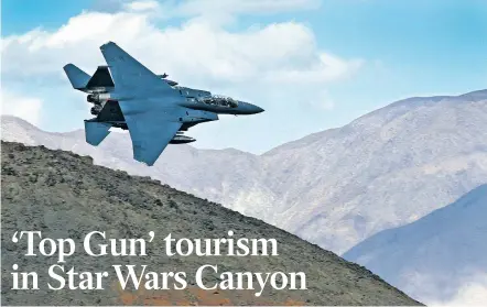  ?? PHOTOS BEN MARGOT/THE ASSOCIATED PRESS ?? An F-15E Strike Eagle from Seymour Johnson Air Force Base in North Carolina flies out of the gorge nicknamed Star Wars Canyon over Death Valley National Park, Calif., in February. Military jets roaring over national parks have long drawn complaints...