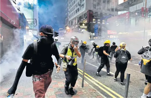  ?? AFP ?? Protesters gather at the Causeway Bay MTR station in Hong Kong on Sunday after the police fired tear gas.