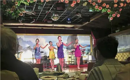  ??  ?? Stop trading in China: North Korean performers entertaini­ng customers at the Okryugwan restaurant in Beijing in this file photo. — AP