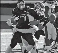  ?? Arkansas Democrat-Gazette/RICK McFARLAND ?? Greenwood’s Andrew McGill has the ball jarred loose by Pine Bluff’s Braylon Jones on an incomplete pass. Pine Bluff held Greenwood to its lowest scoring output of the season.