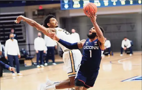  ?? Matt Slocum / Associated Press ?? UCo nn’s R.J. Cole (1) goes up for a shot against Villanova’s Jermaine Samuels during the second half on Feb. 20.