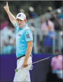  ?? Khadejeh Nikouyeh ?? The Associated Press Brandt Snedeker celebrates after sinking an eagle putt on the 15th hole Friday during the second round of the Wyndham Championsh­ip at Sedgefield Country Club.