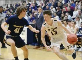  ?? OWEN MCCUE - MEDIANEWS GROUP ?? Pope John Paul II’s Drew McKeon, right, drives on Spring-Ford’s Alex Lewis in a PAC semifinal game.