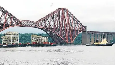  ?? Picture: Amec Foster Wheeler. ?? The BiFab-built PAUs pass under the Forth Rail Bridge.