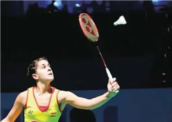  ?? AFP ?? Luck’s on her side Carolina Marin of Spain returns to Nozomi Okuhara of Japan during their women’s singles match as part of the Dubai World Superserie­s Finals in Dubai yesterday.