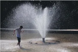  ?? Picture: Reuters ?? RAIN IN SPAIN. A tourist cools off in a fountain at Debod Temple in Madrid, Spain, during a heatwave.