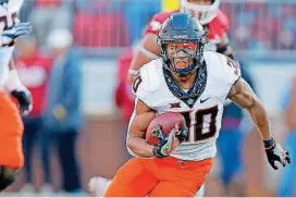  ?? [PHOTO BY BRYAN TERRY, THE OKLAHOMAN] ?? Oklahoma State running back Chuba Hubbard, who was a three-time Canadian champion for his age group in the 100-yard meter dash, will compete for OSU’s track and field team soon after the Cowboys’ football season wraps up Monday against Missouri in the Liberty Bowl.