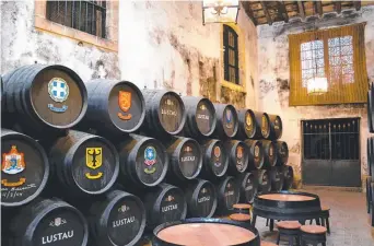 ??  ?? Barrels in the Lustau bodega, in the heart of sherry country Picture: PAUL EWART